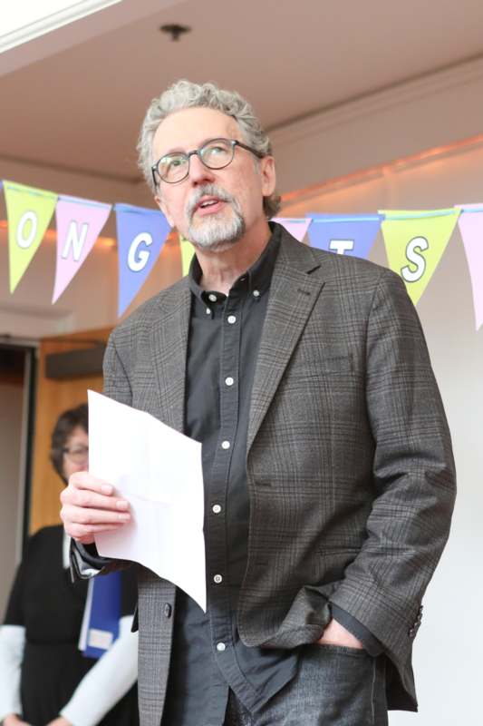 a man holding a piece of paper