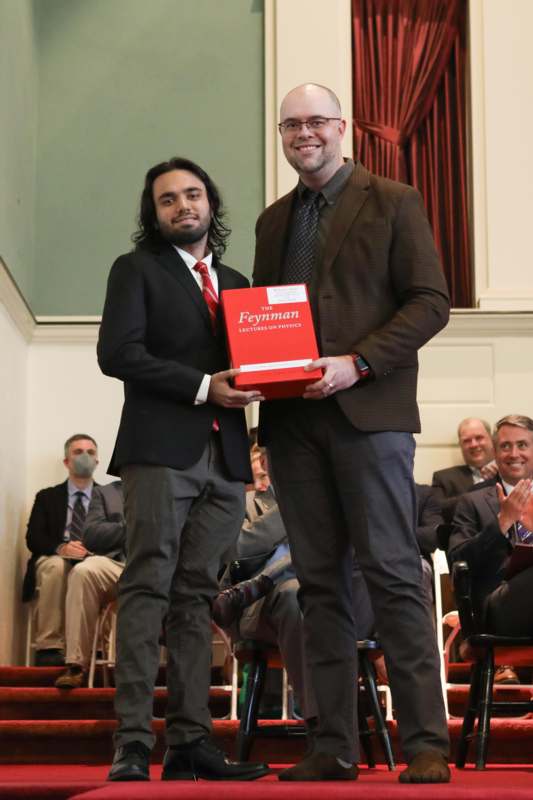 two men holding a box