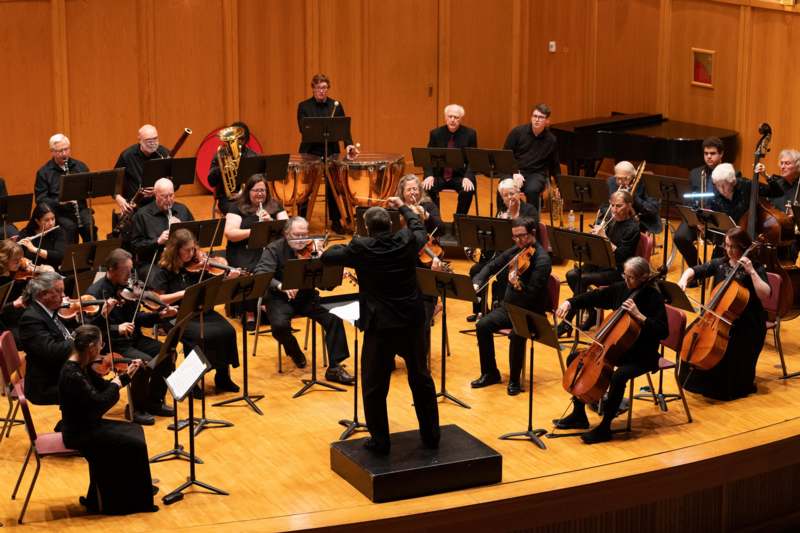 a group of people in a concert hall