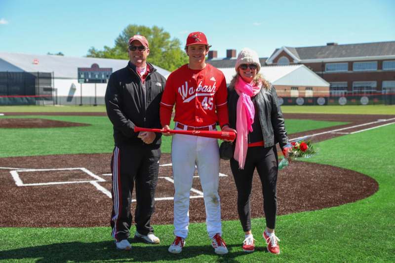 a group of people on a baseball field