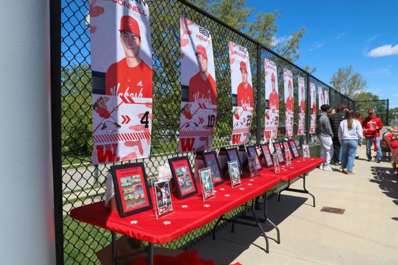 a group of posters on a fence