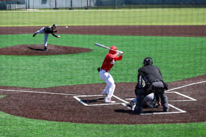 a baseball player swinging a bat