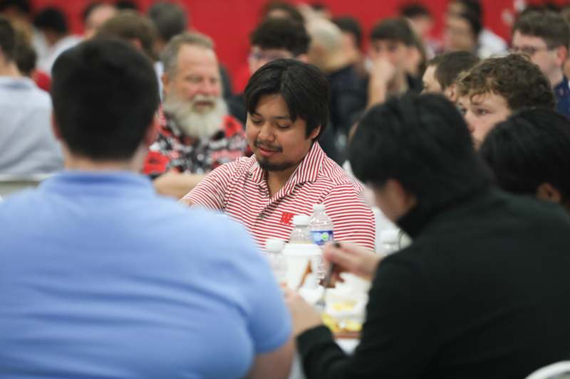 a group of people sitting at a table