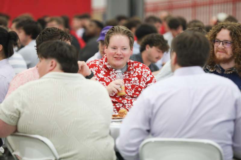 a person sitting at a table with food