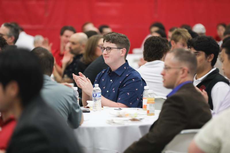 a group of people sitting at a table
