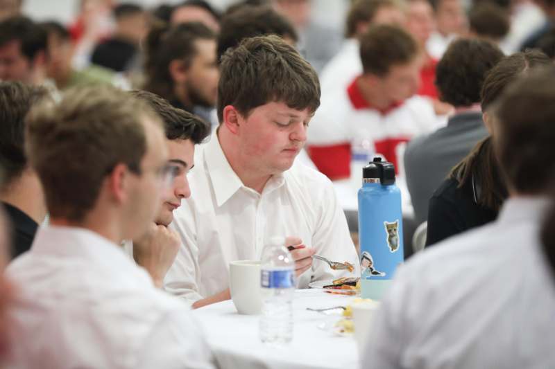 a group of people sitting at a table