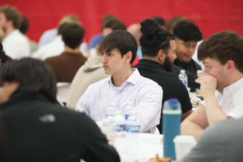 a group of people sitting at tables