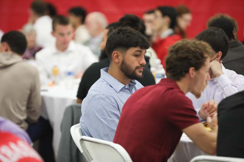 a group of people sitting at tables