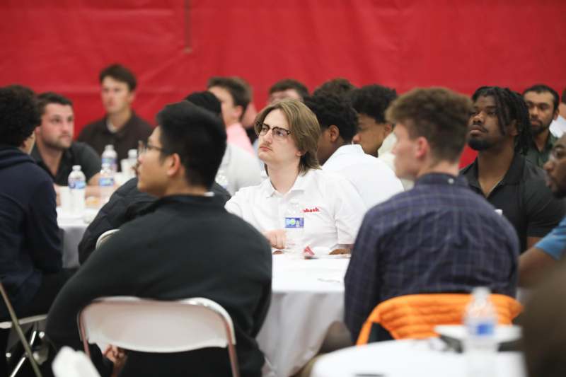 a group of people sitting at tables