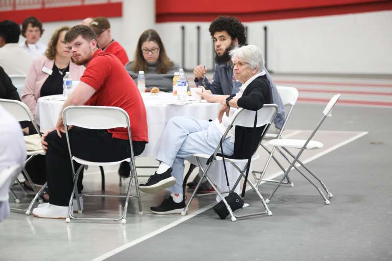 a group of people sitting at a table