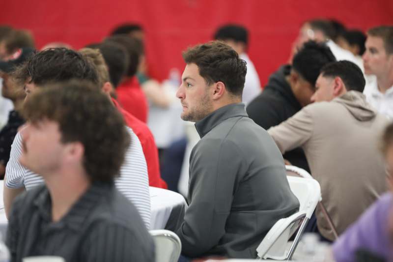 a group of people sitting at tables