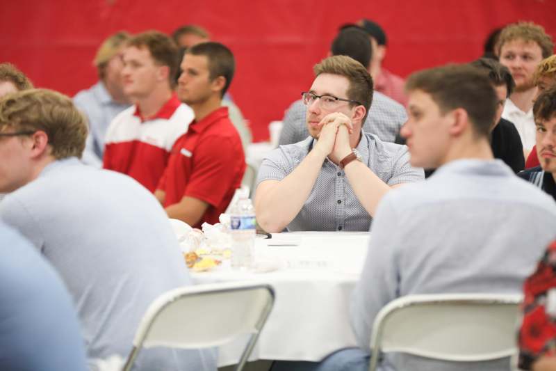 a group of people sitting at tables