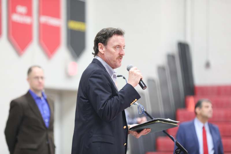 a man speaking into a microphone