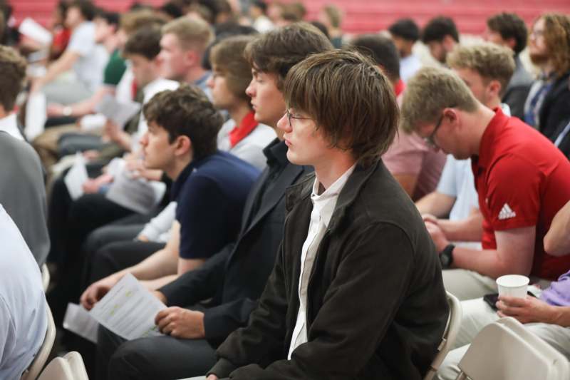 a group of people sitting in chairs