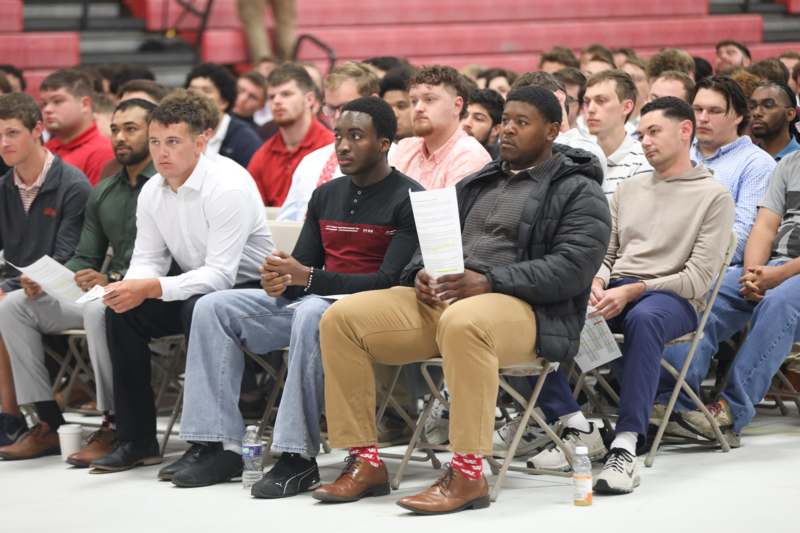 a group of people sitting in chairs