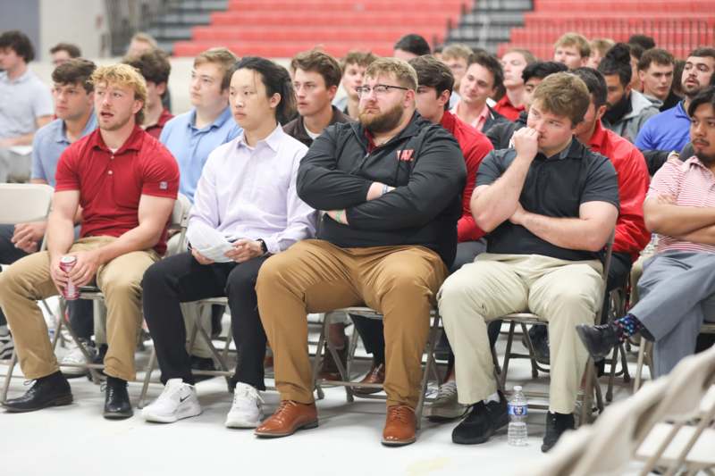 a group of people sitting in chairs