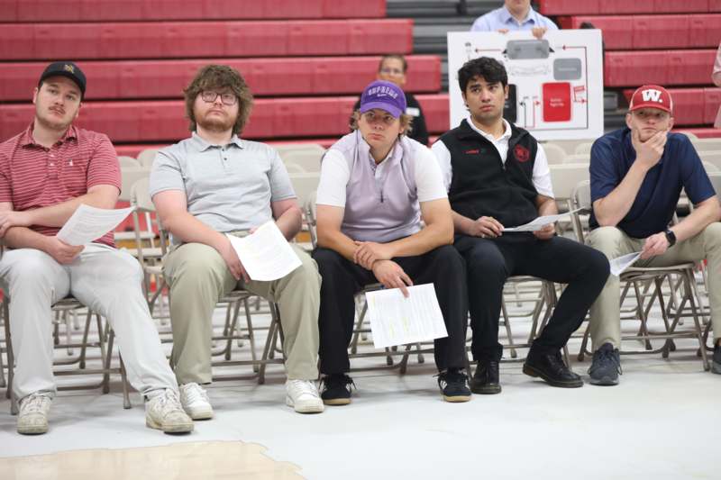 a group of people sitting in chairs