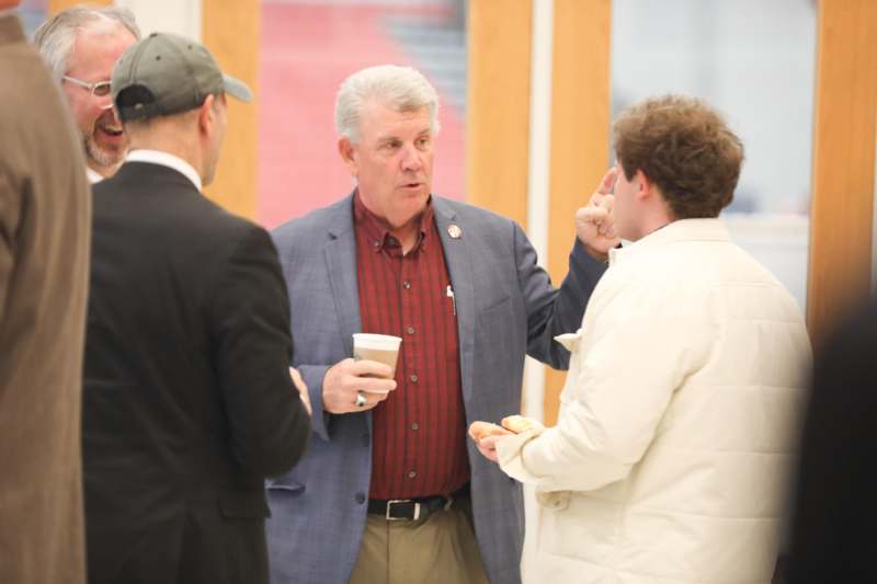 a group of men talking to each other