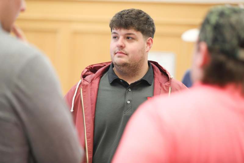 a man in a red jacket