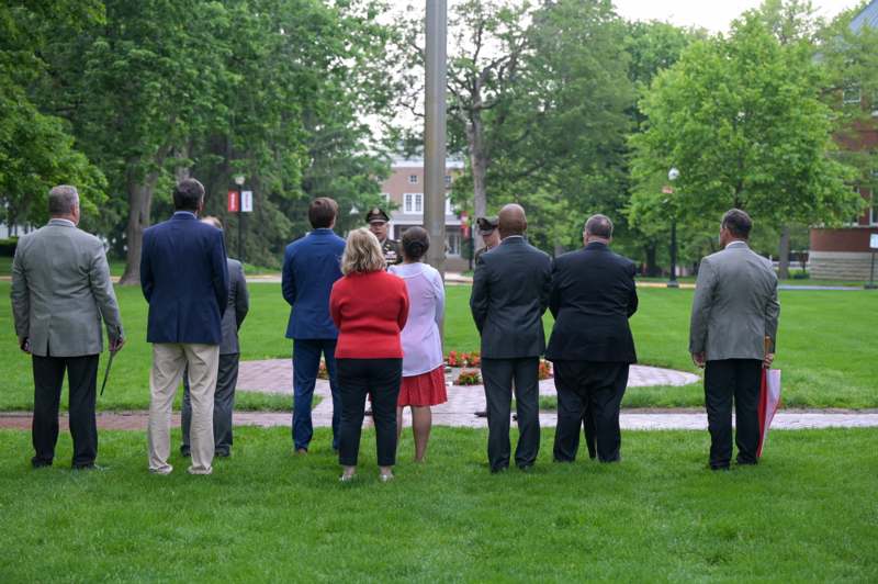 a group of people standing in a field