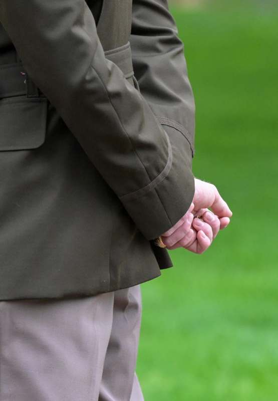 a person in a suit holding hands