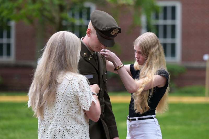 a woman putting a hand on a man's hand