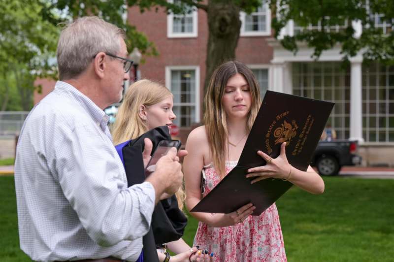 a man and woman looking at a menu