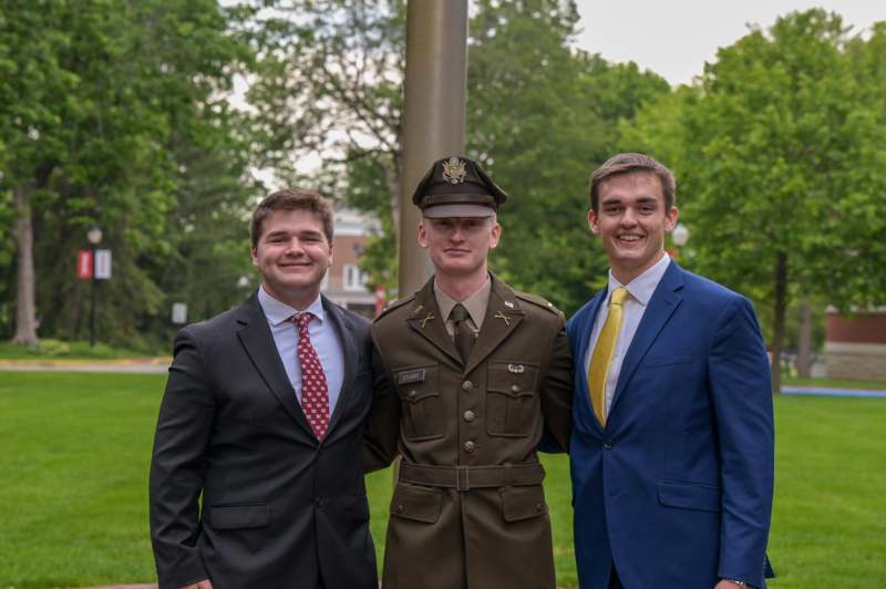a group of men in suits and uniforms