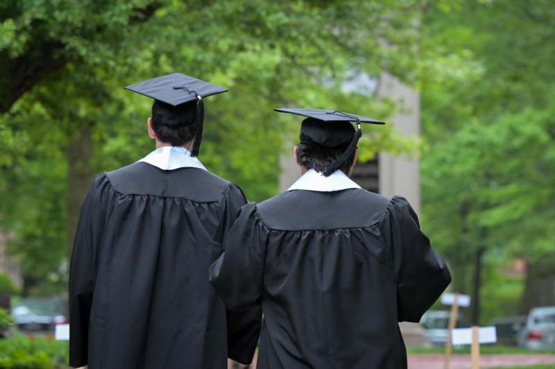 a group of people wearing graduation gowns