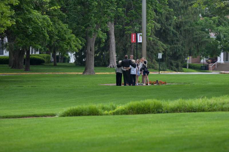a group of people standing in a park
