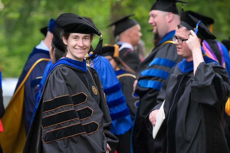 a woman in a graduation gown