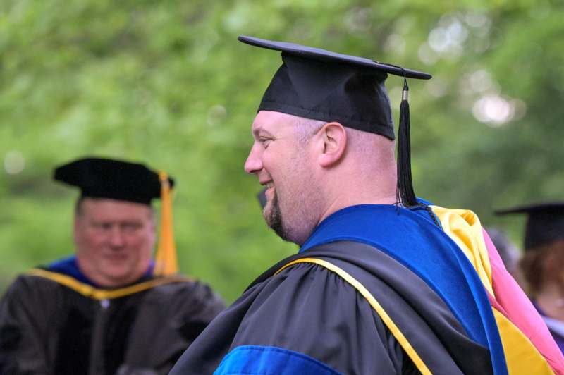 a man in a graduation gown