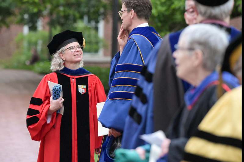 a woman in a graduation gown