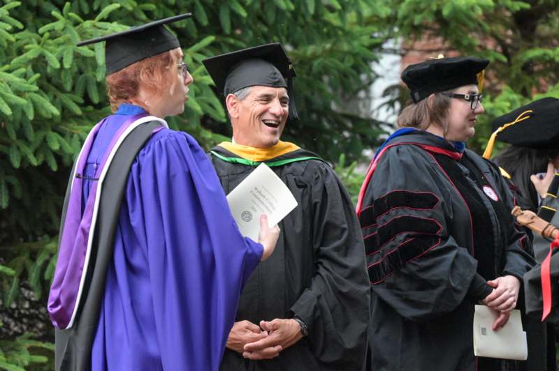 a group of people in graduation gowns