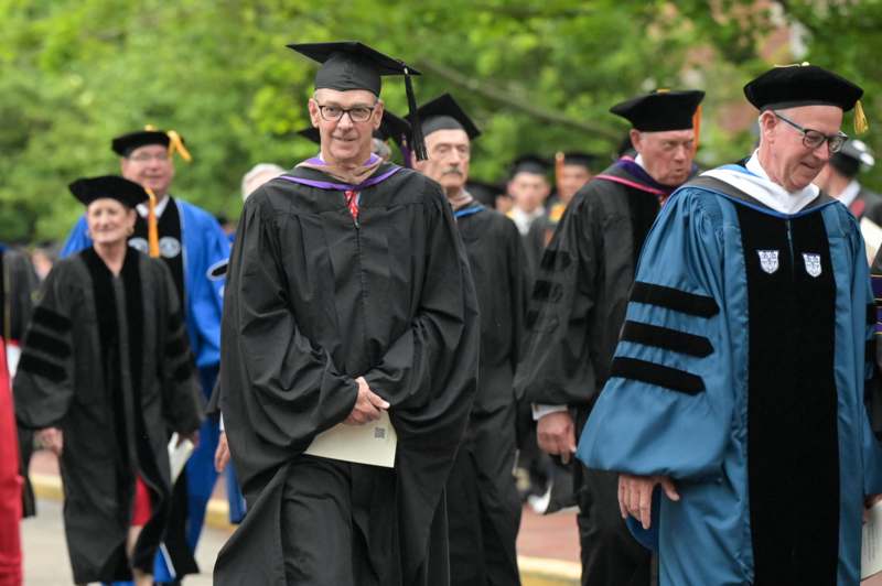 a man in a graduation gown