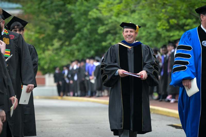 a man in a graduation gown