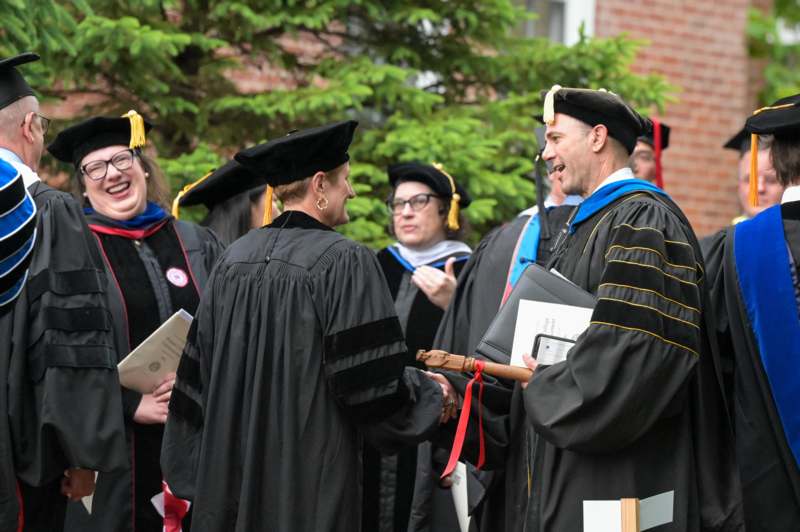 a group of people in graduation gowns