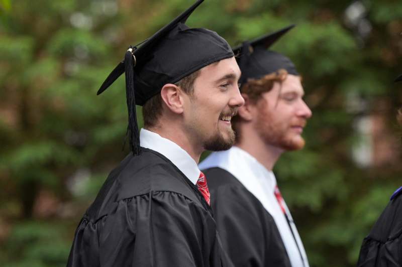 a man in a graduation gown
