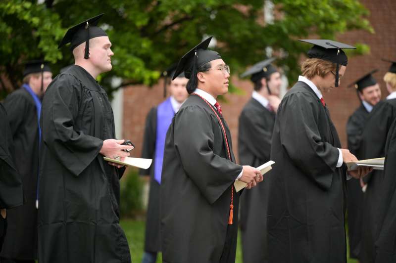 a group of people in graduation gowns