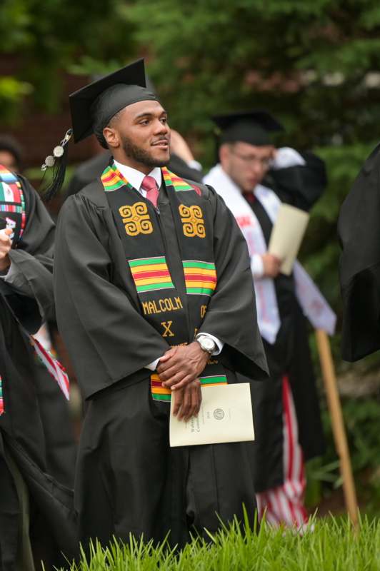 a man in a graduation gown