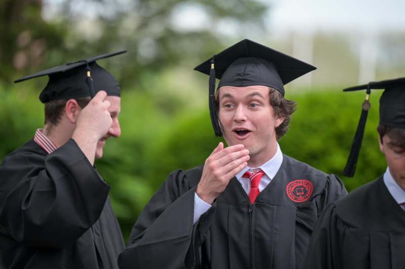 a group of people in graduation gowns