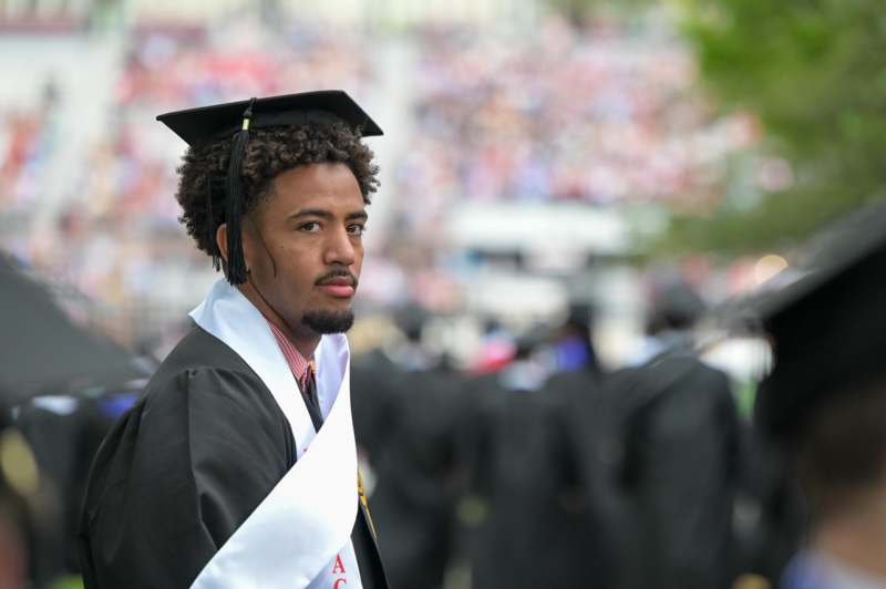 a man in a graduation gown