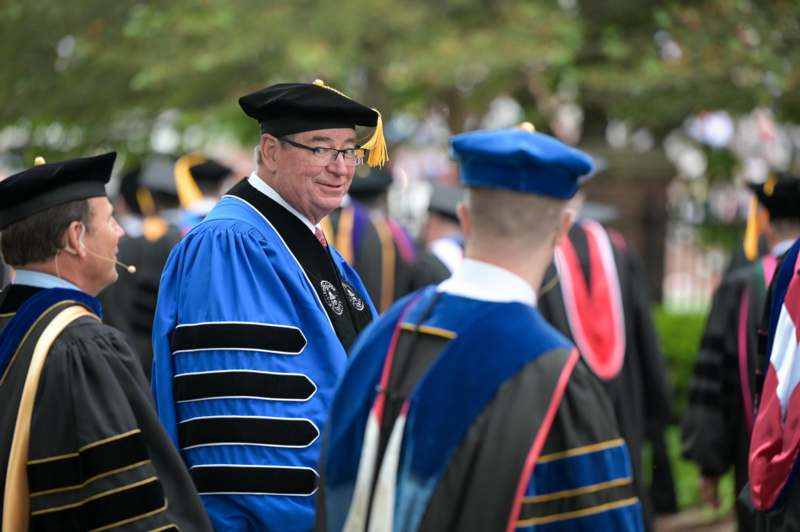 a man in a graduation gown