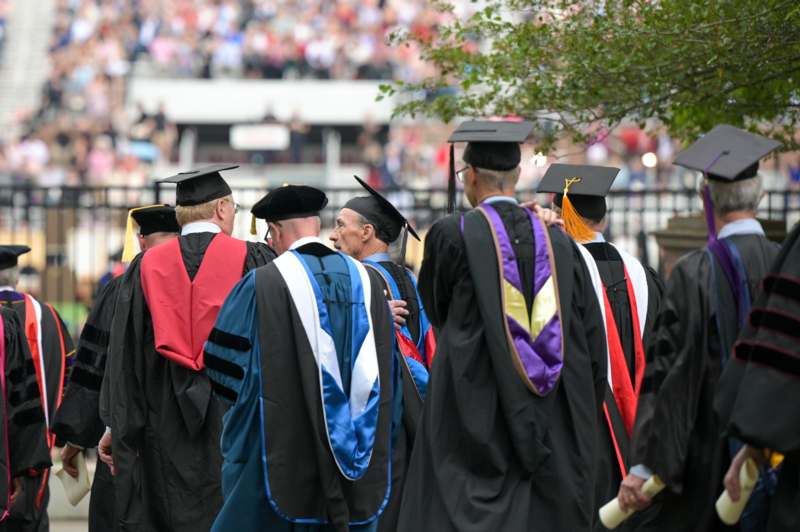 a group of people in graduation gowns
