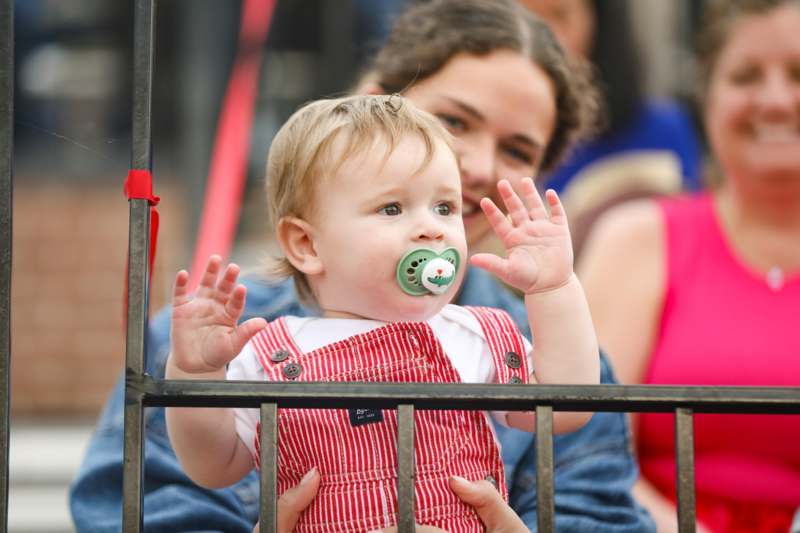 a baby with a pacifier in her hand