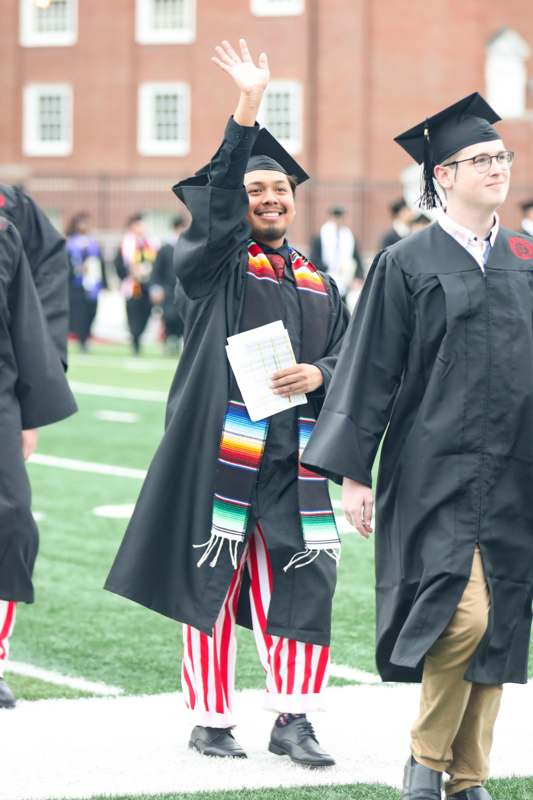 a group of people in graduation gowns and caps
