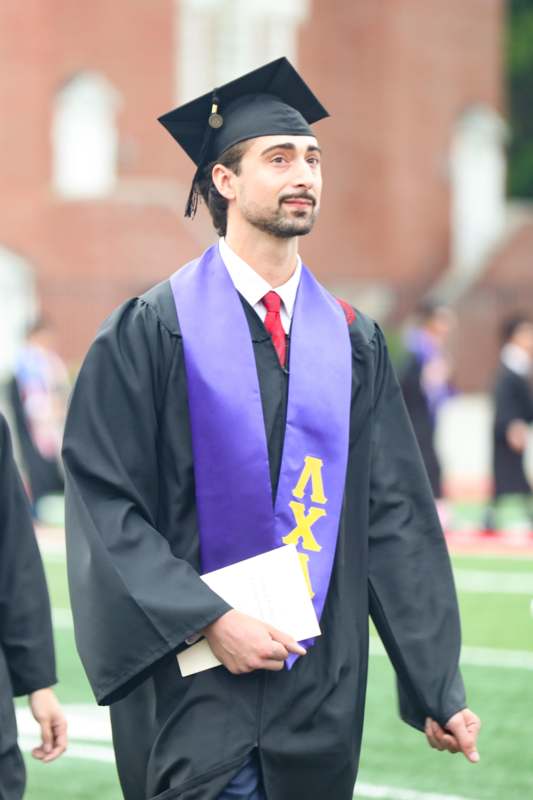 a man in a graduation gown
