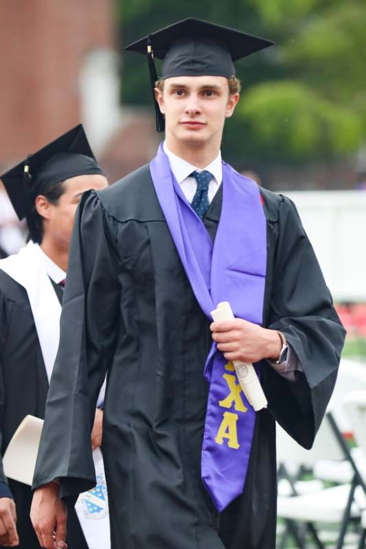 a man in a graduation gown
