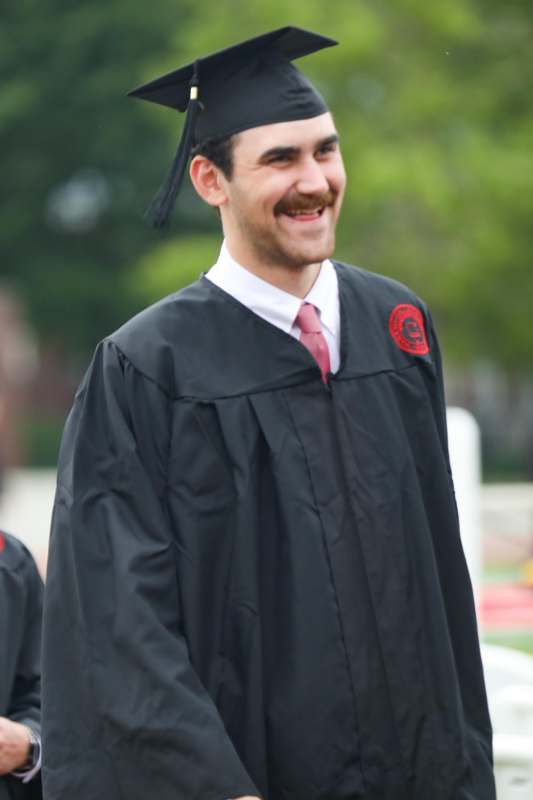 a man in a graduation gown