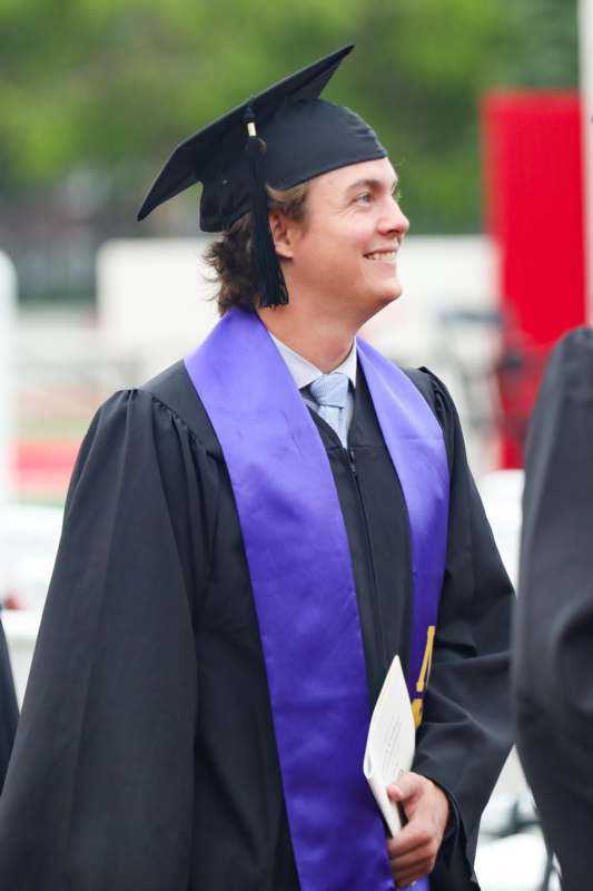 a man in a graduation gown